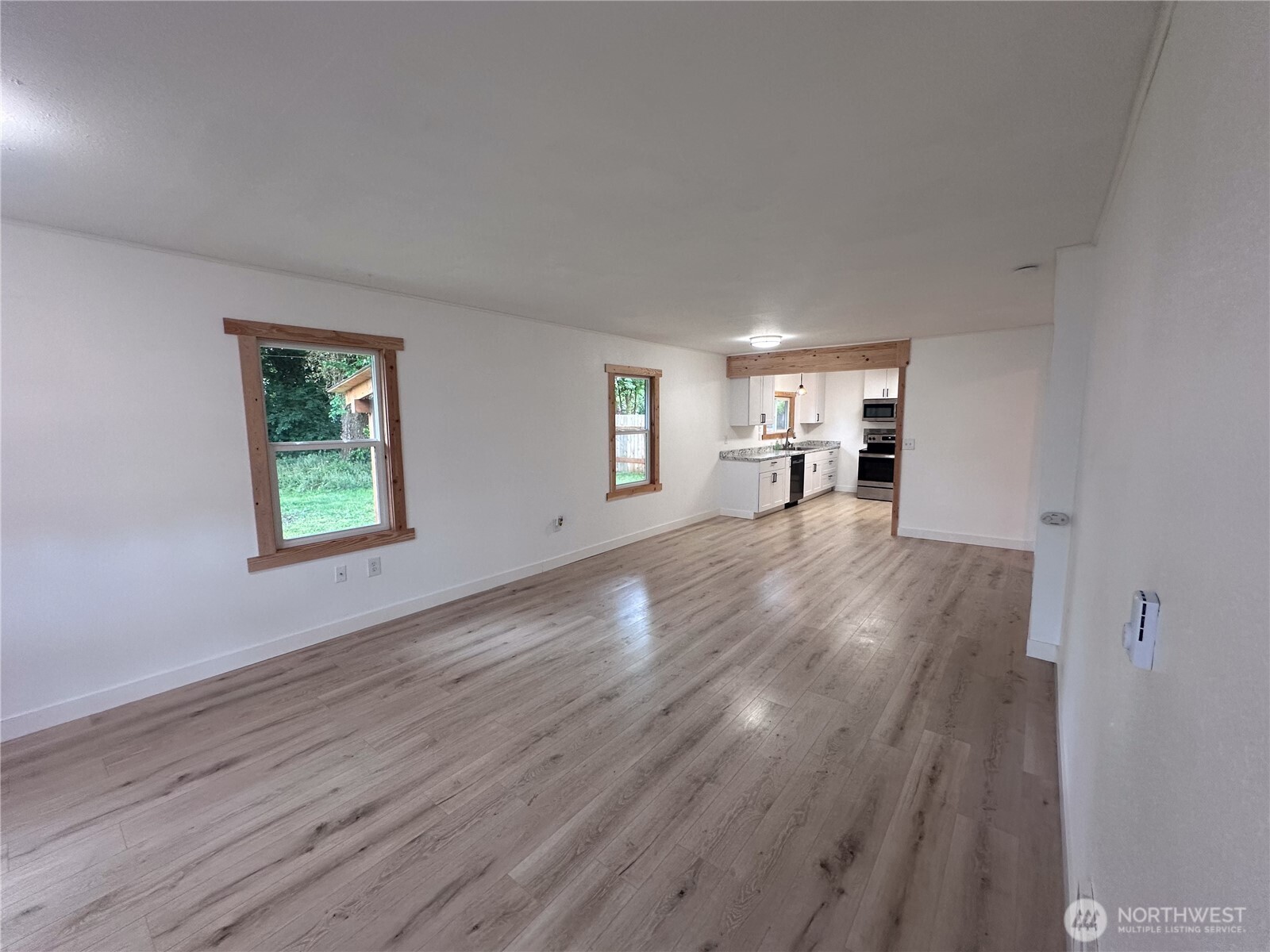 10341 184th Avenue Southwest Rochester, WA 98579 - Photo 6 of 36 a view of empty room with wooden floor and fan