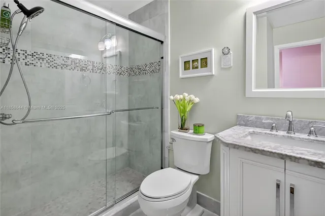 a bedroom with a bed and a lamp on table