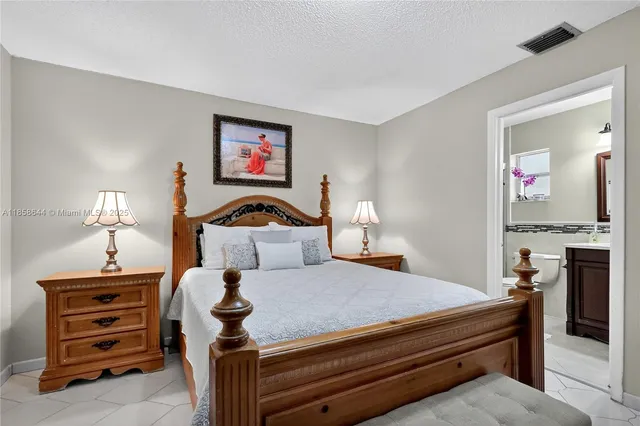 a bathroom with a sink vanity mirror and toilet