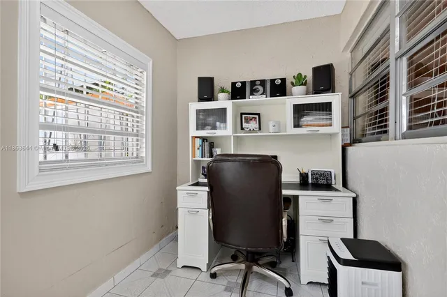 a view of two chairs in the room