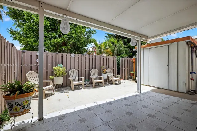 a view of a house with outdoor seating area