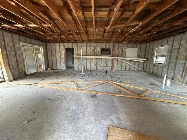 a view of a hall with wooden floor