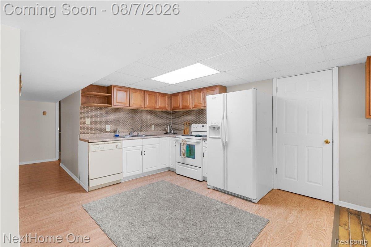 6260 Faussett Road Howell, MI 48855 - Photo 27 of 44 Additional full kitchen in basement.