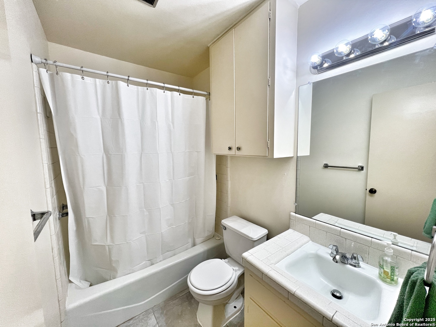 343 Bobolink Drive New Braunfels, TX 78130 - Photo 13 of 18 a bathroom with a sink toilet and shower