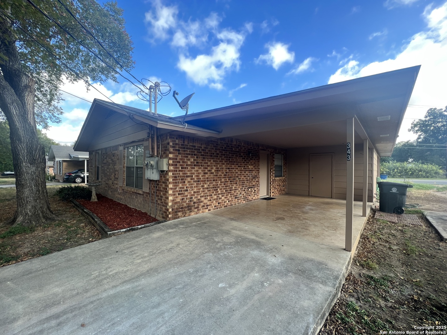 343 Bobolink Drive New Braunfels, TX 78130 - Photo 2 of 18 a view of a house with a yard and garage