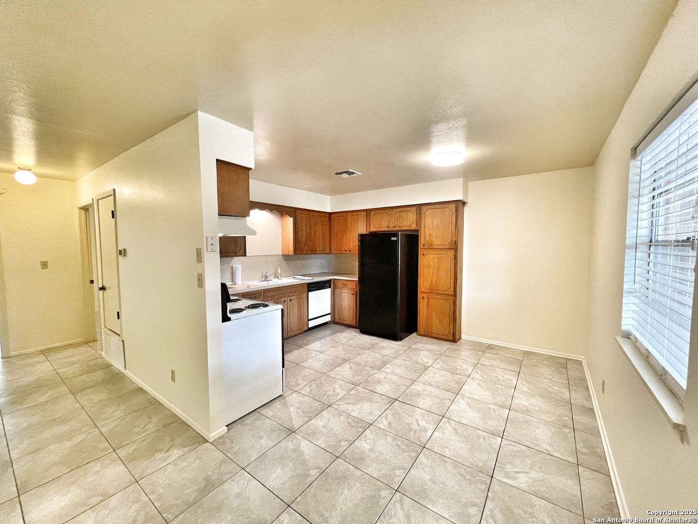 343 Bobolink Drive New Braunfels, TX 78130 - Photo 6 of 18 a view of kitchen with furniture and window