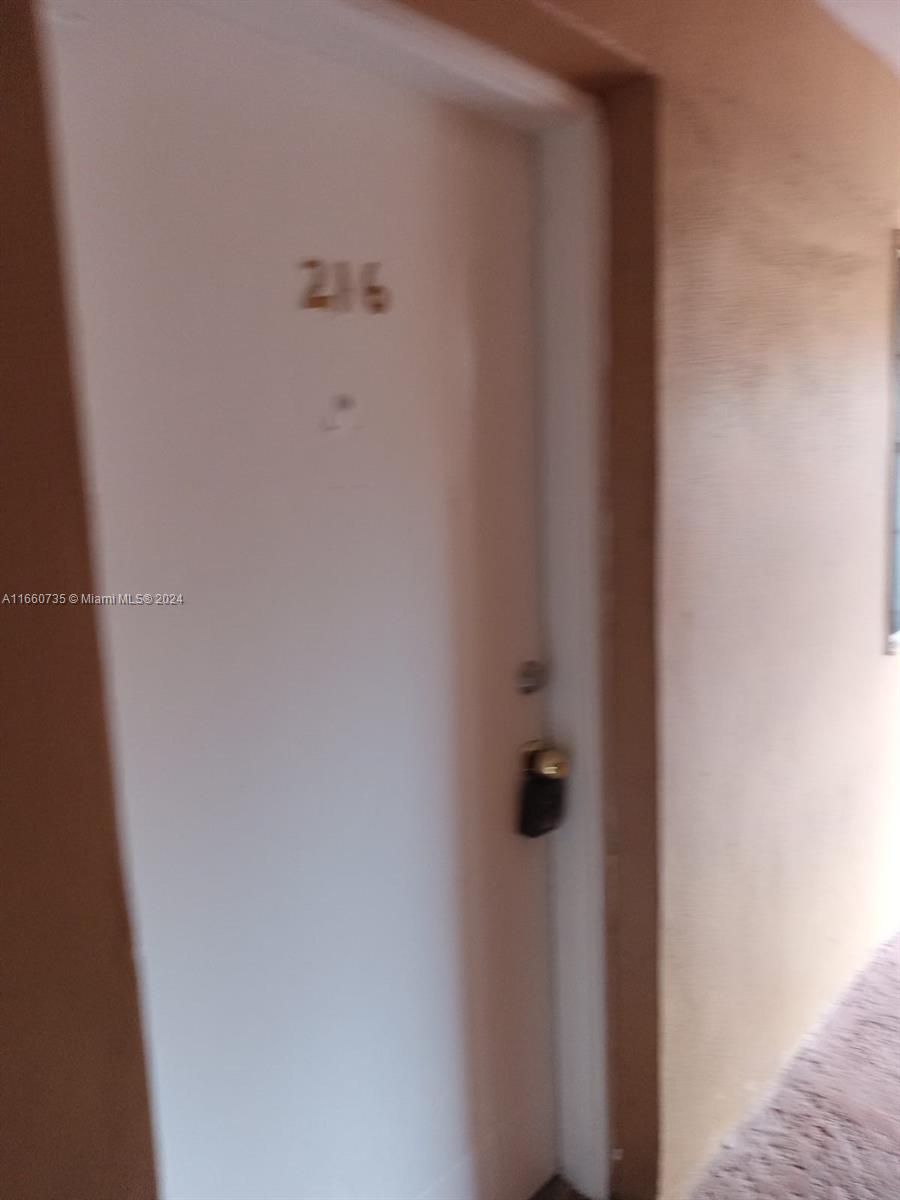 1230 West 54th Street, Unit 216A Hialeah, FL 33012 - Photo 1 of 28 a bathroom with a shower