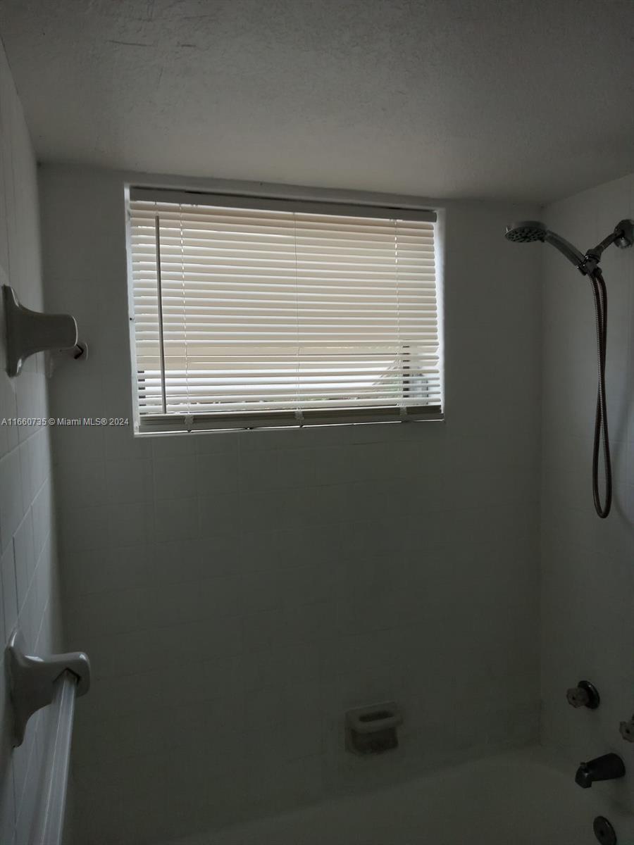 1230 West 54th Street, Unit 216A Hialeah, FL 33012 - Photo 26 of 28 a view of a small space with a window