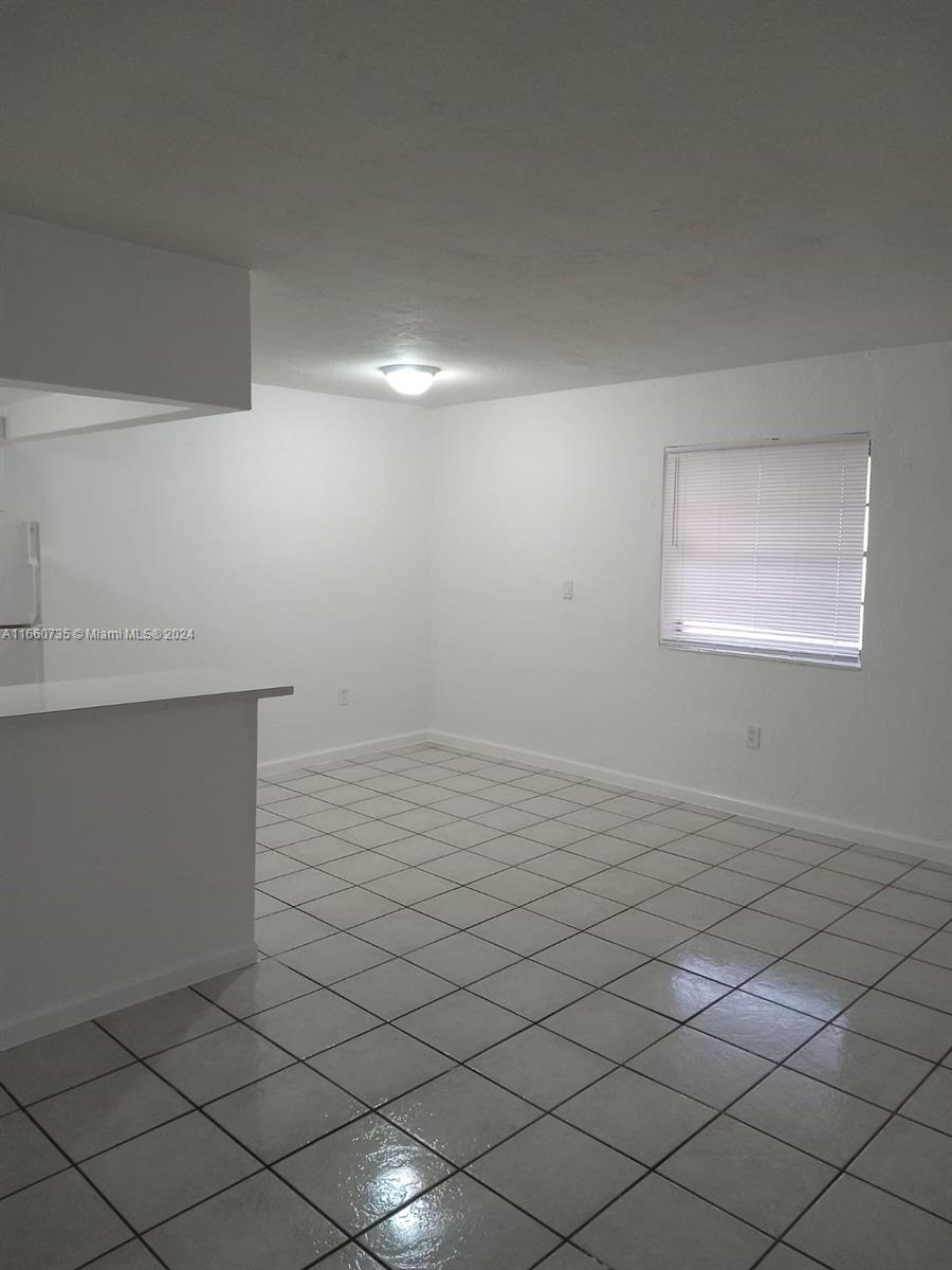 1230 West 54th Street, Unit 216A Hialeah, FL 33012 - Photo 8 of 28 a view of room and window