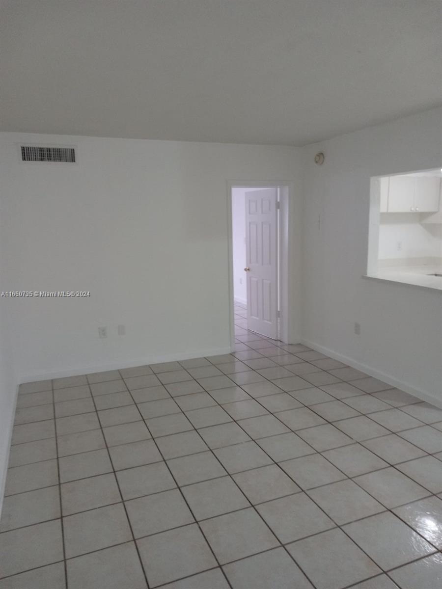 1230 West 54th Street, Unit 216A Hialeah, FL 33012 - Photo 10 of 28 a view of an empty room and window