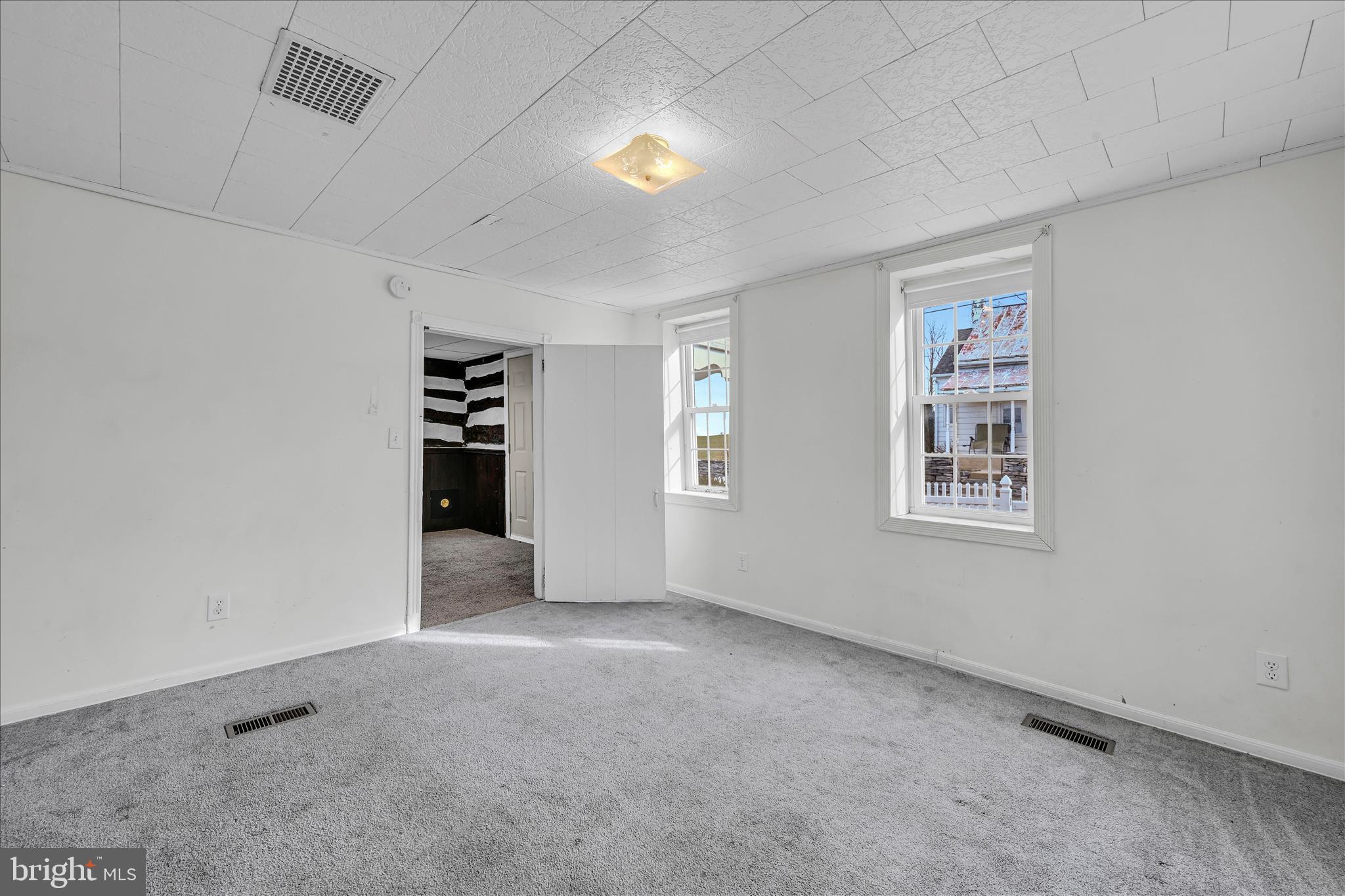 470 Weavertown Road Myerstown, PA 17067 - Photo 24 of 38 an empty room with a window and fireplace