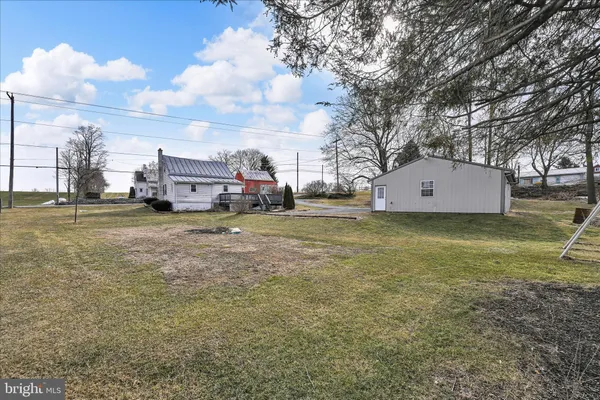 a view of house with yard