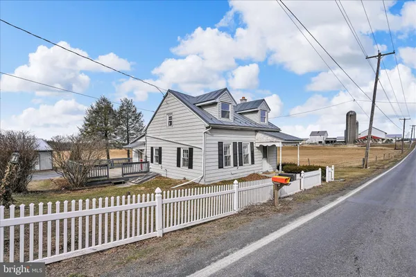 a front view of a house with a small yard