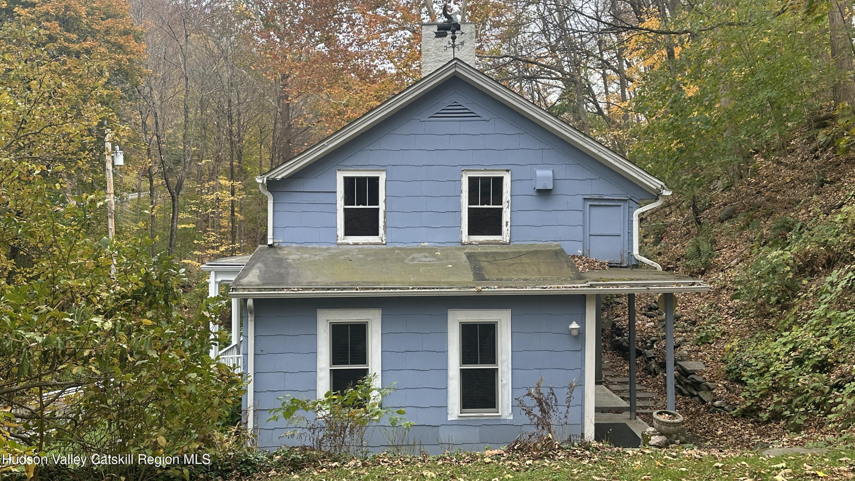 7 River Road, Unit TOWN ROAD Highland, NY 12528 - Photo 12 of 25 a front view of a house with yard and trees