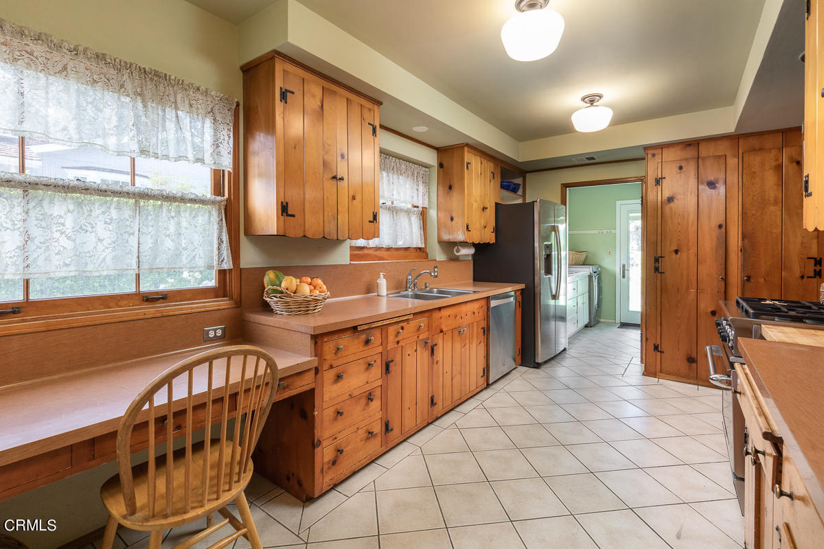 424 North Old Ranch Road Arcadia, CA 91007 - Photo 14 of 54 a kitchen with stainless steel appliances a sink cabinets and wooden floor