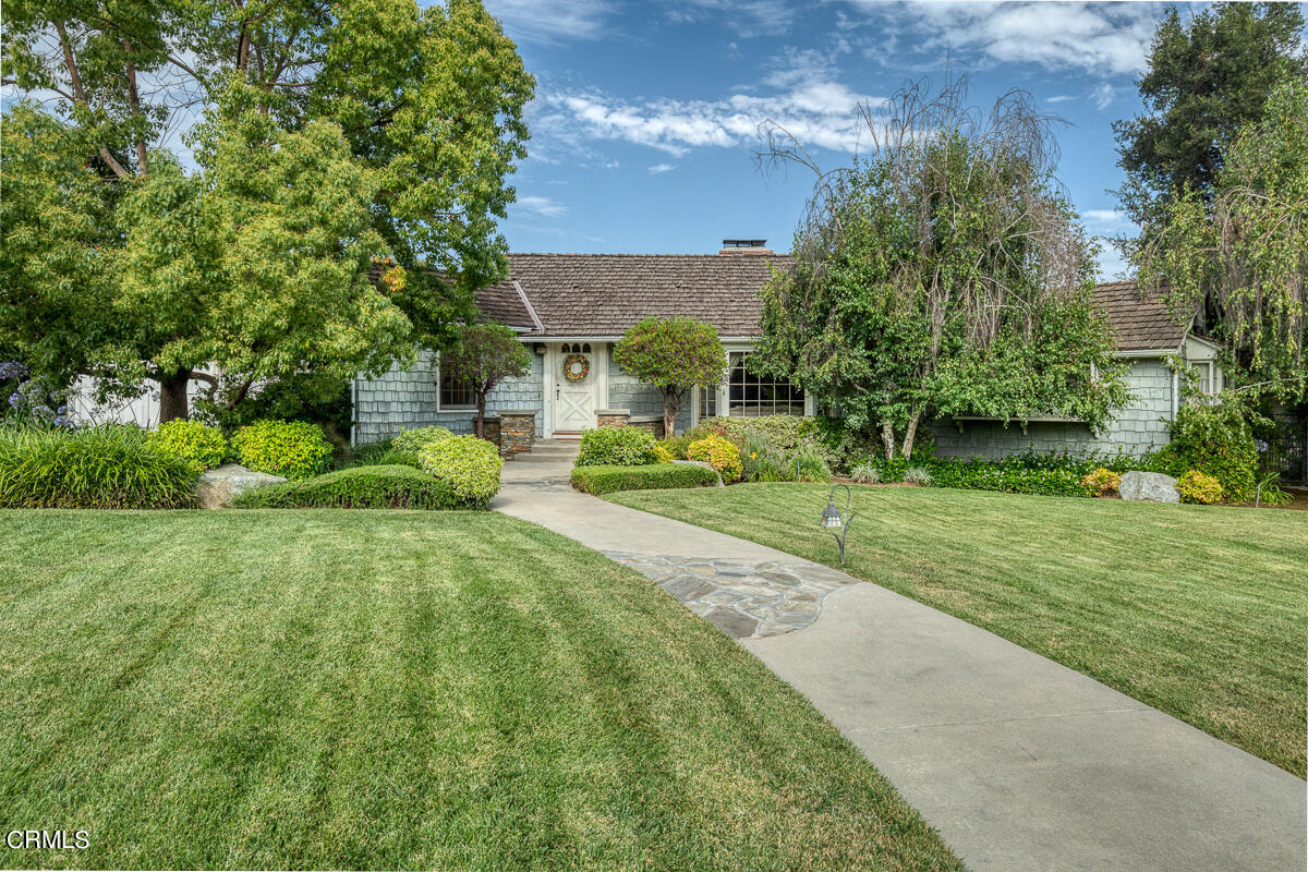 424 North Old Ranch Road Arcadia, CA 91007 - Photo 3 of 54 a front view of a house with a yard table and chairs