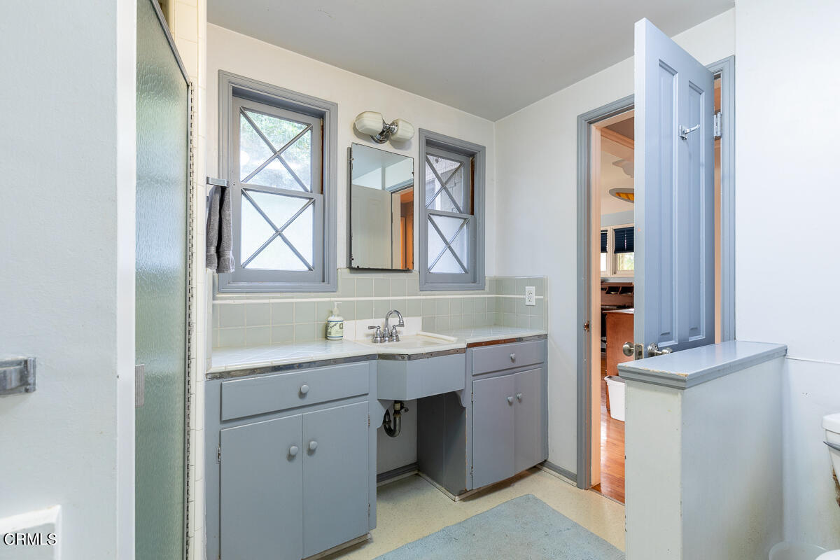 424 North Old Ranch Road Arcadia, CA 91007 - Photo 37 of 54 a room with a sink and a mirror