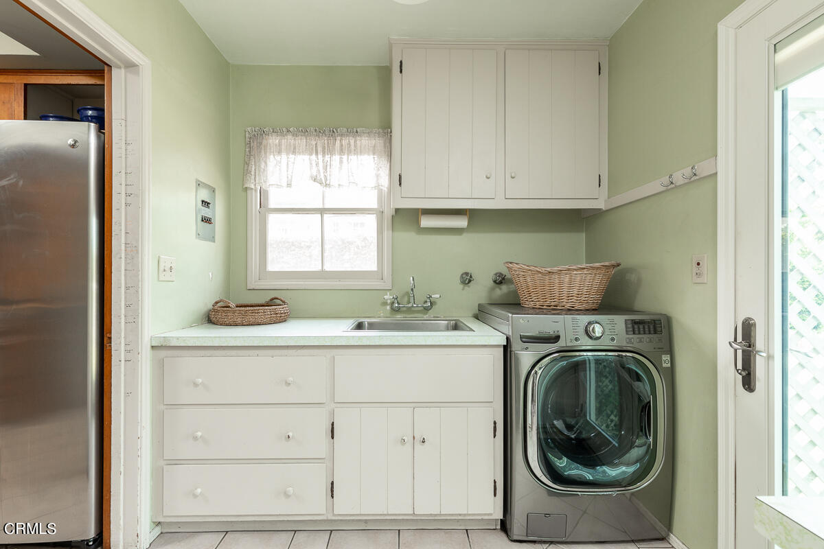 424 North Old Ranch Road Arcadia, CA 91007 - Photo 38 of 54 a utility room with sink dryer and washer