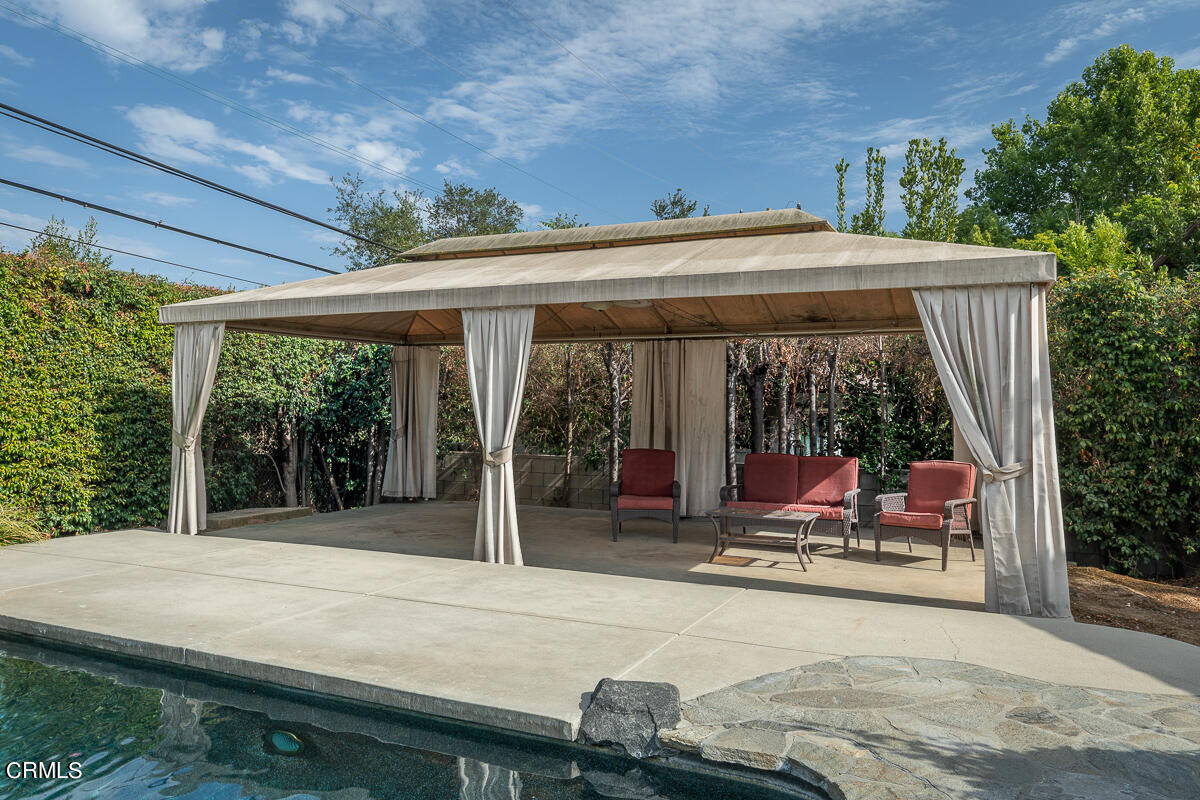 424 North Old Ranch Road Arcadia, CA 91007 - Photo 46 of 54 a view of a patio with table and chairs next to a yard