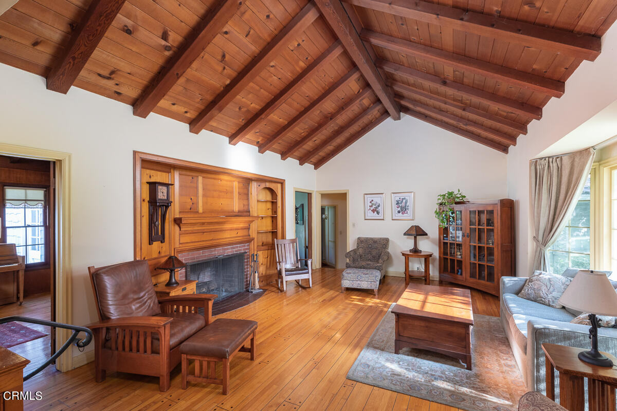 424 North Old Ranch Road Arcadia, CA 91007 - Photo 7 of 54 a living room with furniture a fireplace and wooden floor