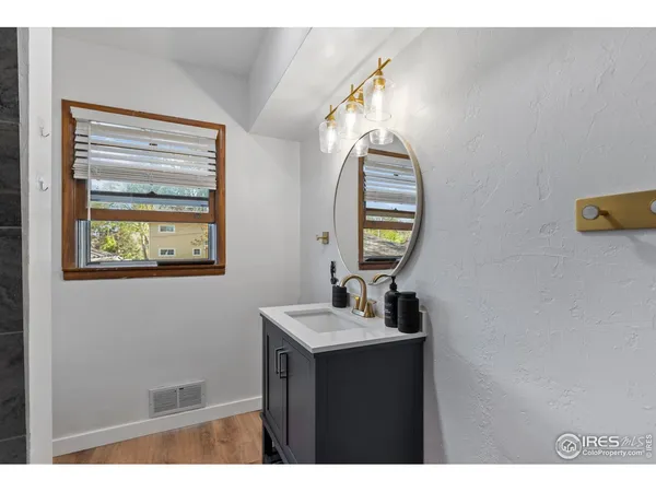a bathroom with a glass shower door
