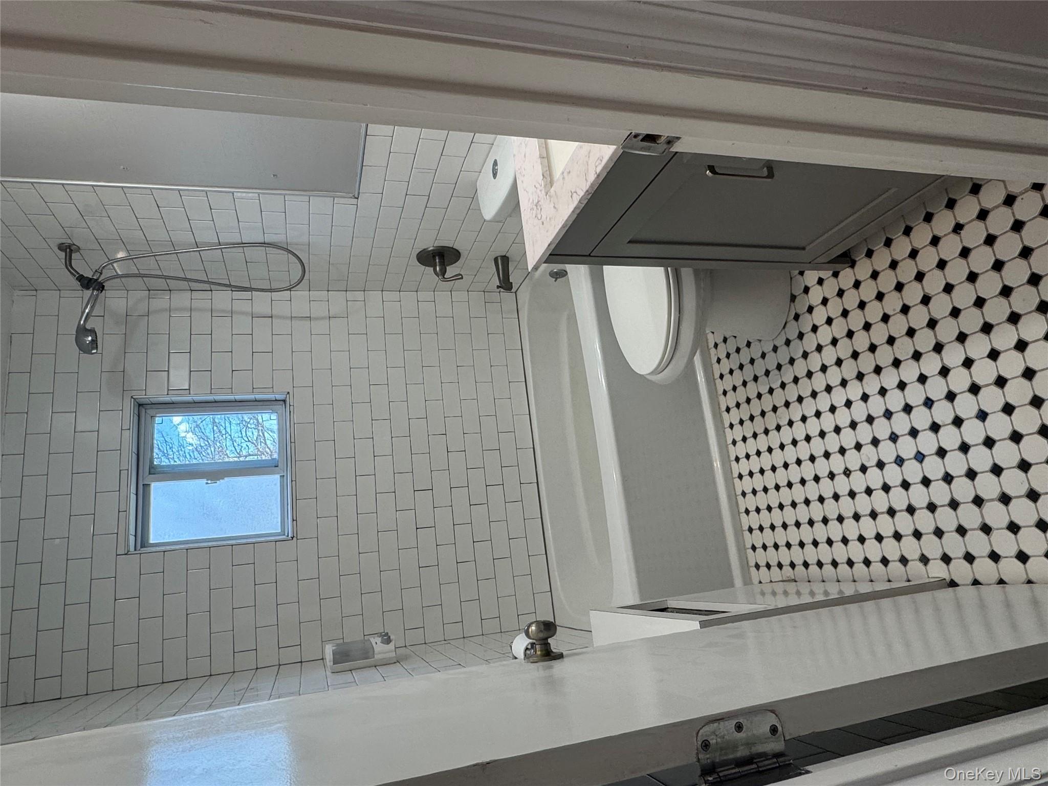 1239 August Road North Babylon, NY 11703 - Photo 14 of 16 a bathroom with a sink a toilet and shower