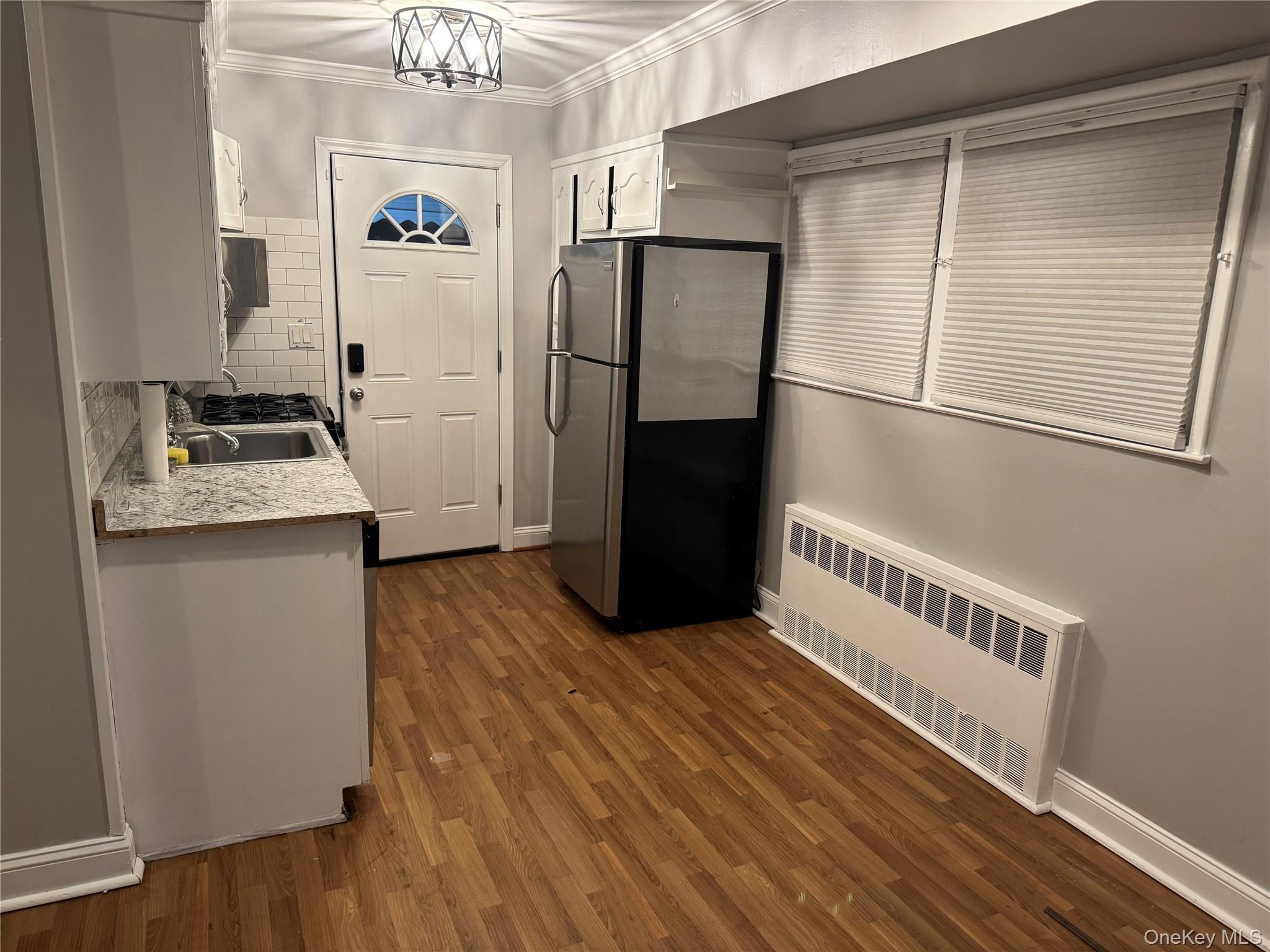 1239 August Road North Babylon, NY 11703 - Photo 4 of 16 a kitchen with a refrigerator and a stove