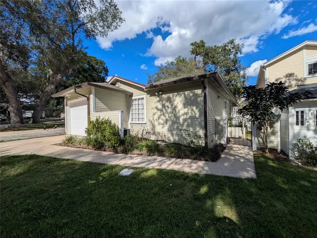 a view of a house with a yard