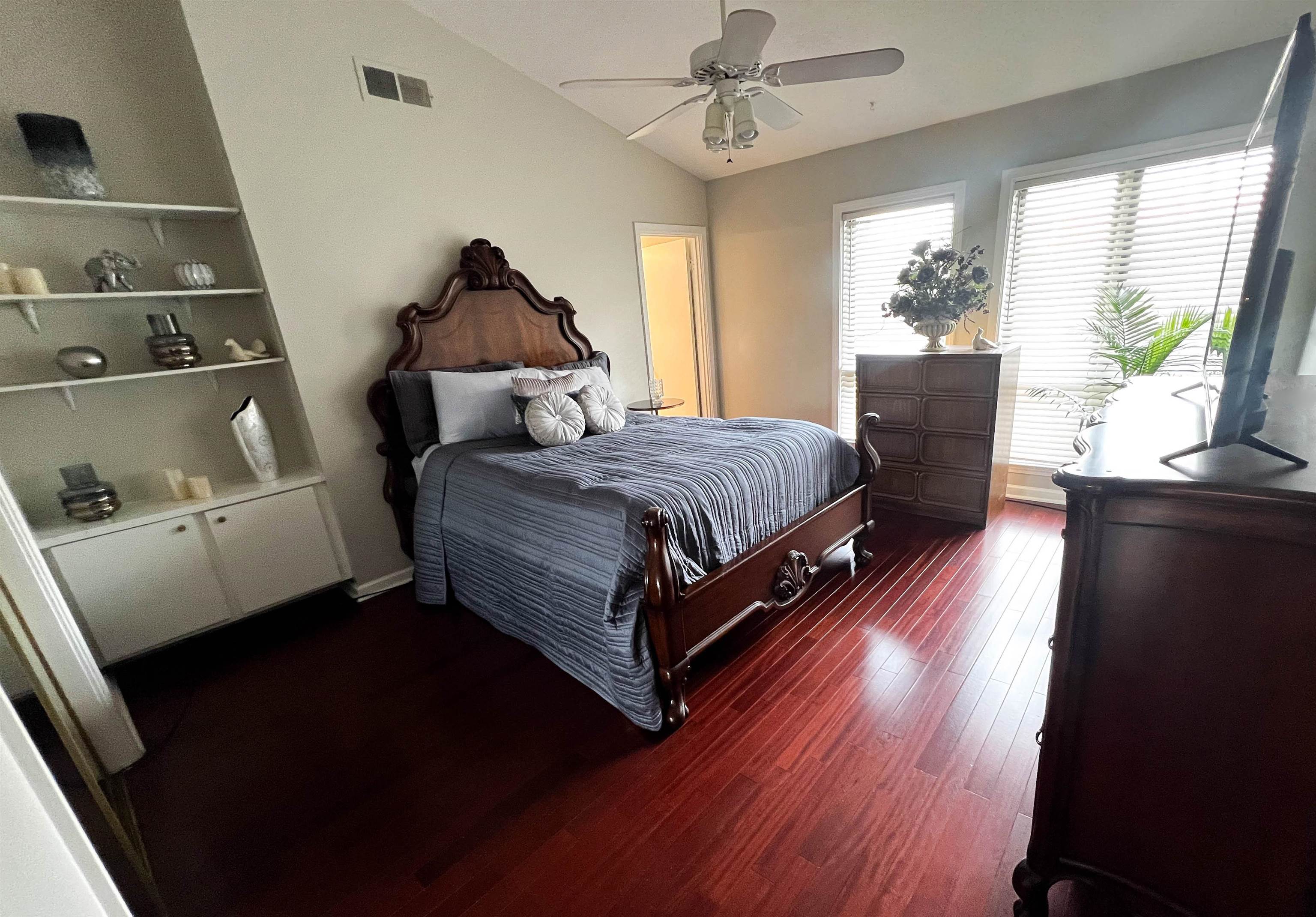 435 South Perkins Road Memphis, TN 38117 - Photo 4 of 21 Bedroom with dark wood-type flooring, ceiling fan, and lofted ceiling