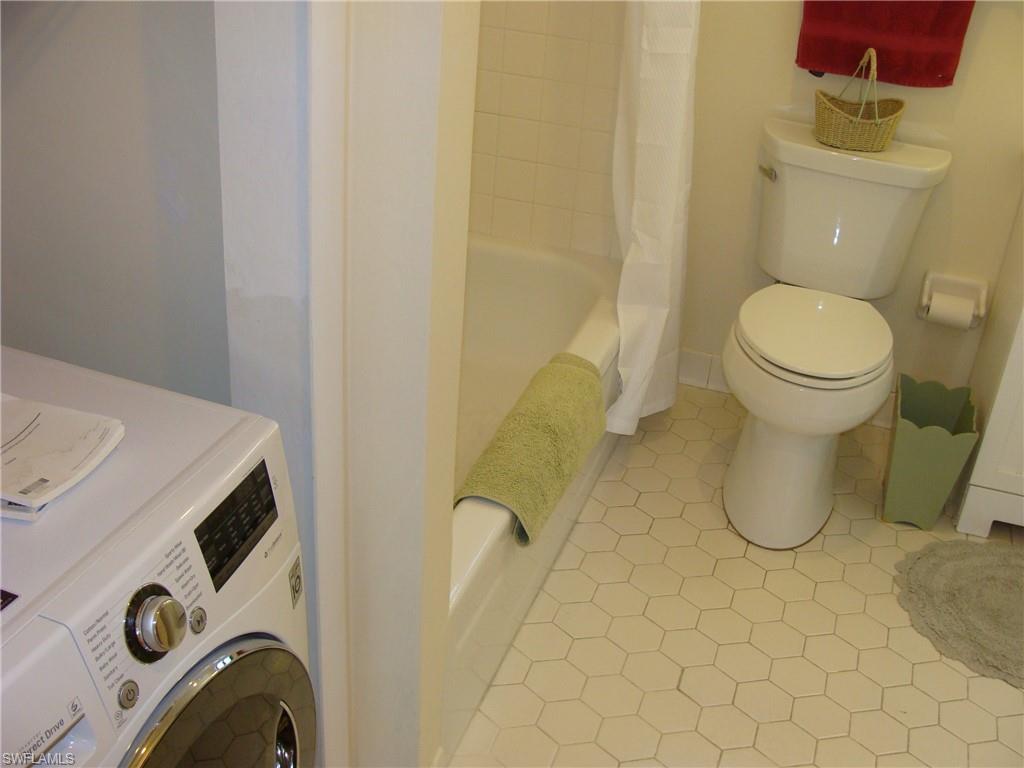 807 River Point Drive, Unit 201D Naples, FL 34102 - Photo 17 of 31 a bathroom with a sink and a toilet