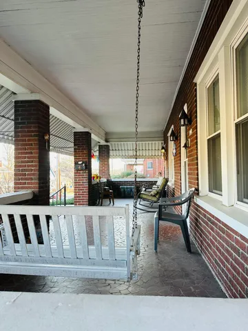 a view of a living room and kitchen with furniture