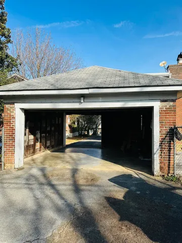 a kitchen with a stove and a shower