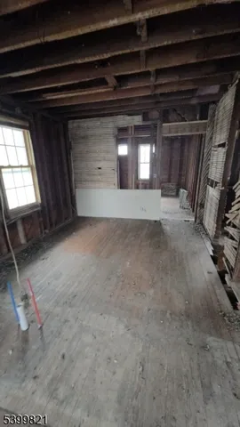 a view of a house with a tree