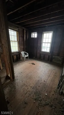 a view of empty room with a fireplace