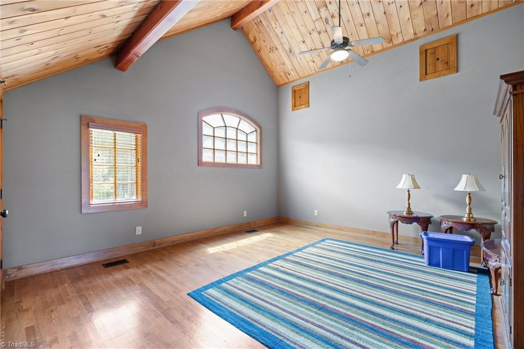 7239 Bulb Road Julian, NC 27283 - Photo 35 of 50 Second level bedroom with cathedral ceiling