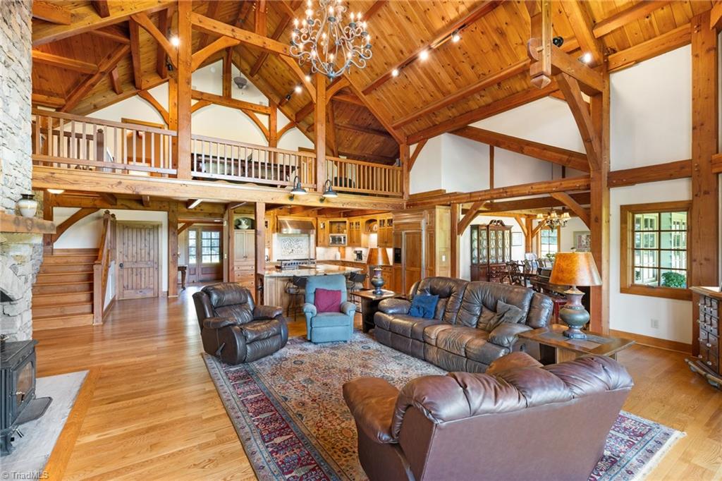 7239 Bulb Road Julian, NC 27283 - Photo 7 of 50 Cathedral ceiling with exposed wood beams