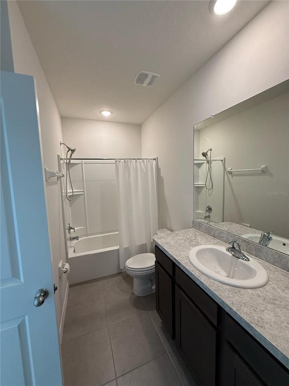16177 Glowing Grove Avenue Odessa, FL 33556 - Photo 6 of 13 a bathroom with a granite countertop sink toilet and shower