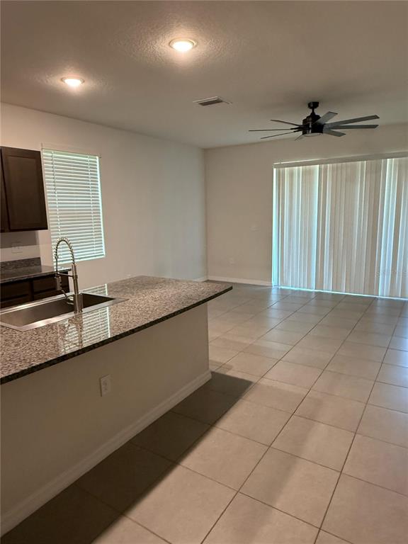 16177 Glowing Grove Avenue Odessa, FL 33556 - Photo 9 of 13 a view of a kitchen with a sink and a window