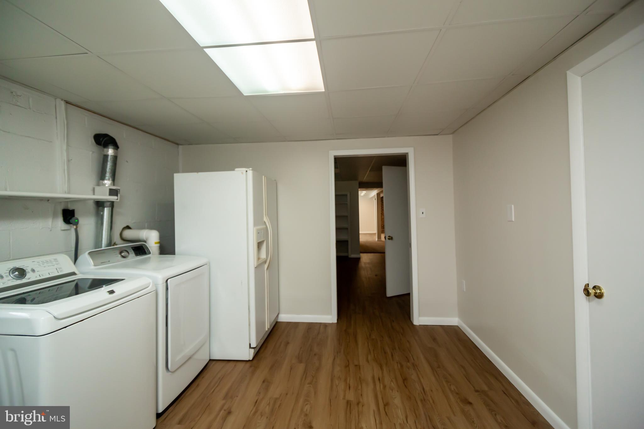 11623 Rivershore Drive Dunkirk, MD 20754 - Photo 43 of 49 a kitchen with a refrigerator a stove and wooden floor