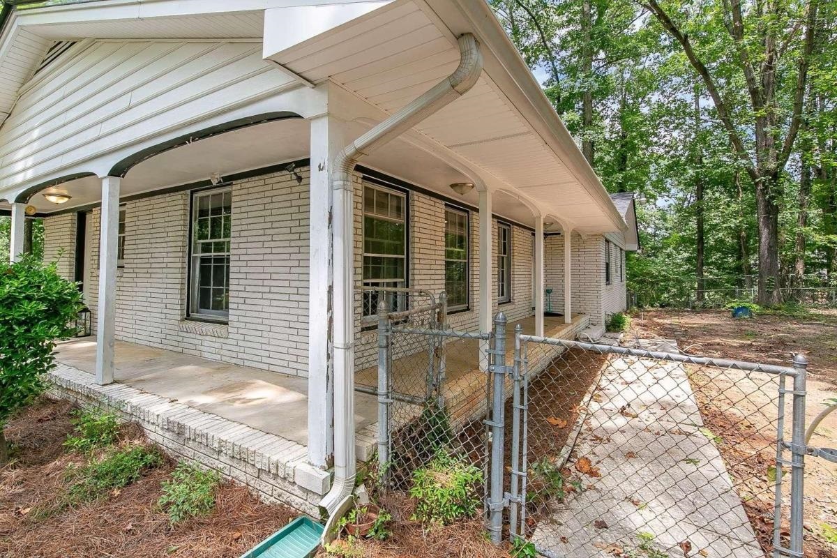 1791 Austin Road Southwest Atlanta, GA 30331 - Photo 1 of 1 a view of house with backyard and sitting area