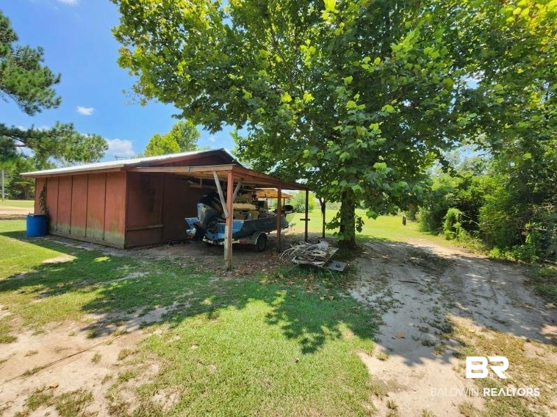 640 Horseshoe Road Brewton, AL 36426 - Photo 21 of 22 View of yard with a carport
