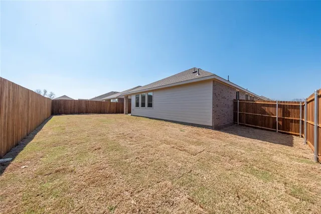 a view of backyard of house