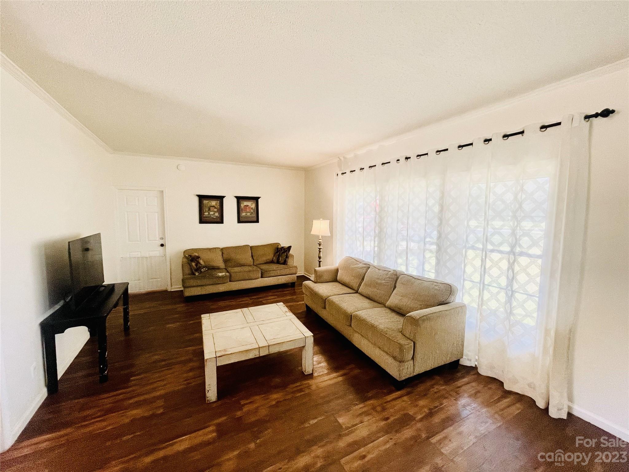 922 State Rd S-46-1102 York, SC 29745 - Photo 13 of 20 a living room with furniture and a flat screen tv