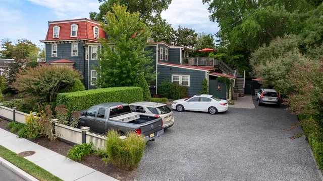 a view of a parked cars in front of a house