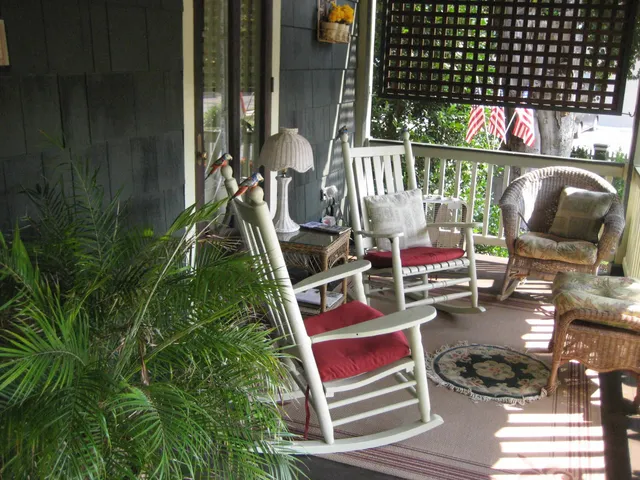 a backyard of a house with lots of green space and fountain
