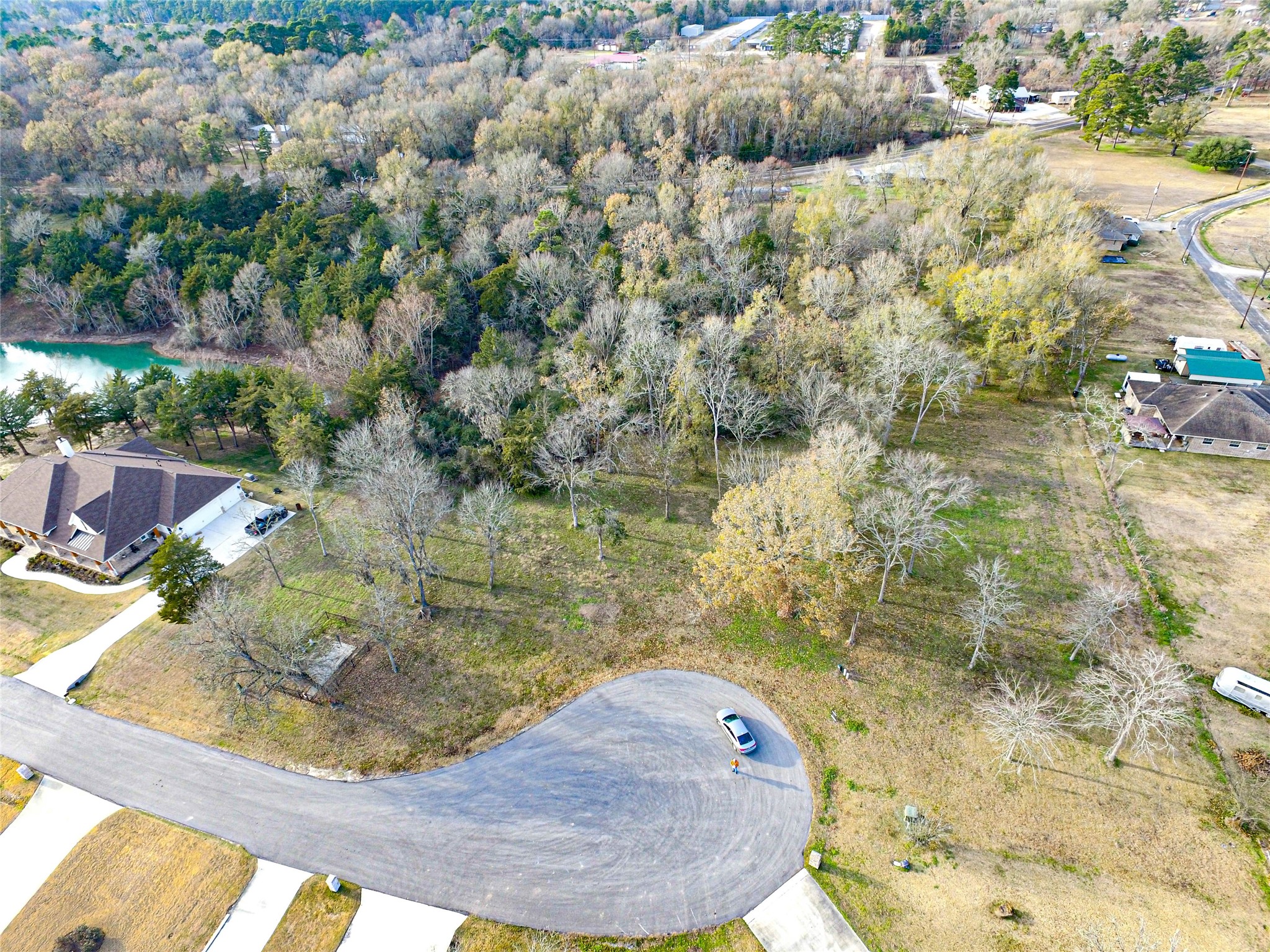 131 Legacy Boulevard Point Blank, TX 77364 - Photo 5 of 17 131 Legacy is located in the curve on this cul-de-sac, allowing you a larger water frontage view