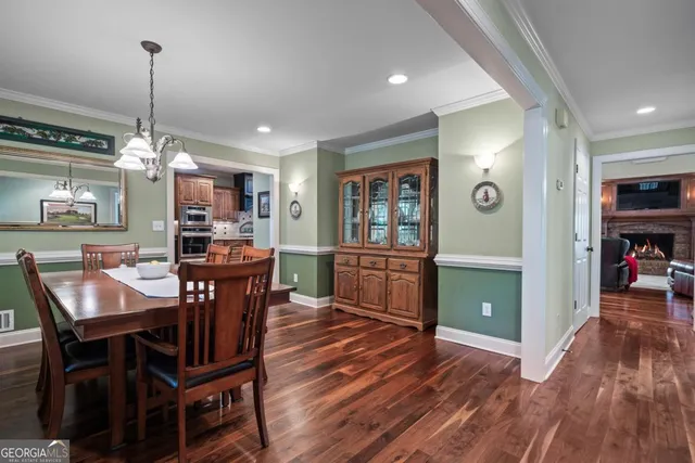 a view of a deck with two chair and wooden floor