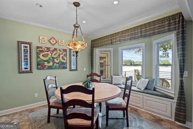 a kitchen with stainless steel appliances granite countertop a refrigerator a stove top oven a sink dishwasher and white cabinets with wooden floor