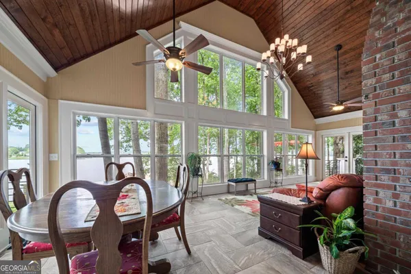 a kitchen with stainless steel appliances kitchen island granite countertop a stove and cabinets