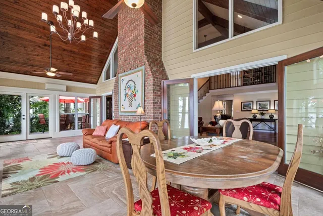 a kitchen with stainless steel appliances granite countertop lots of counter top space and wooden floors